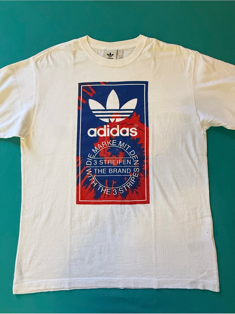 adidas Men’s White Short Sleeve Tee with Blue & Red Graphic